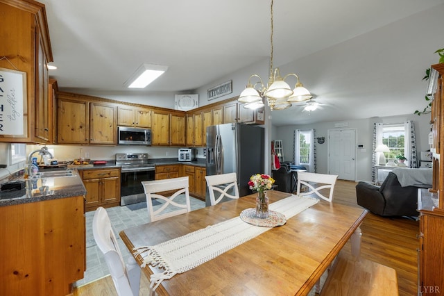 343 Soybean Dr, Appomattox, VA 24522 - dining space featuring light wood-style flooring, a chandelier, and ceiling fan