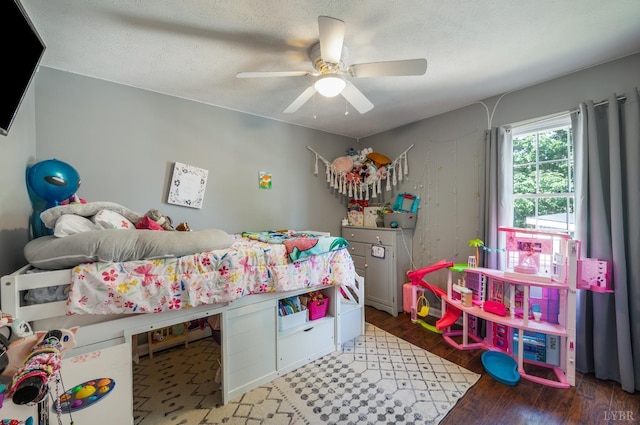 343 Soybean Dr, Appomattox, VA 24522 - bedroom with wood finished floors, a ceiling fan, and a textured ceiling