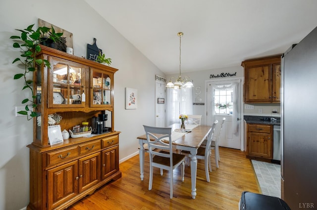343 Soybean Dr, Appomattox, VA 24522 - dining area featuring a chandelier, light wood-style flooring, and lofted ceiling
