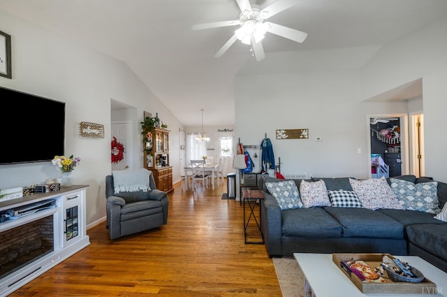 343 Soybean Dr, Appomattox, VA 24522 - living area with vaulted ceiling, wood finished floors, a ceiling fan, a chandelier, and baseboards