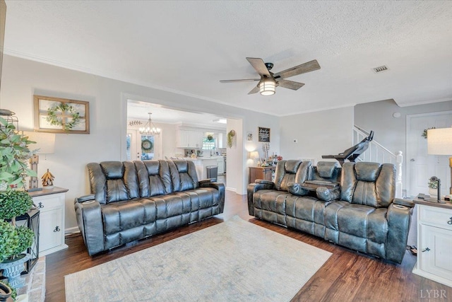 1028 Park Mountain Ter, Huddleston, VA 24104 - living area with dark wood-type flooring, ceiling fan, ornamental molding, a chandelier, and stairway