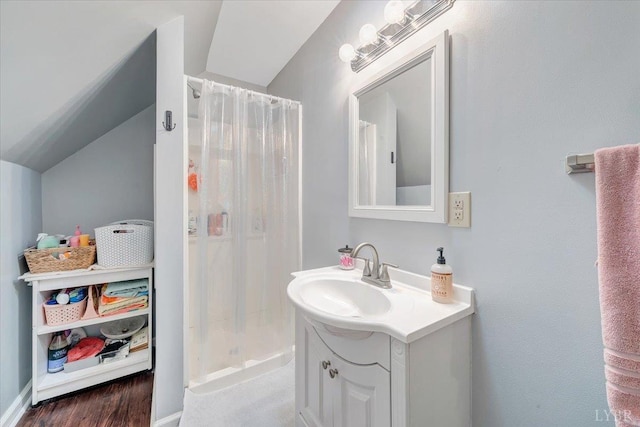 1028 Park Mountain Ter, Huddleston, VA 24104 - bathroom with vanity, a shower stall, vaulted ceiling, and baseboards