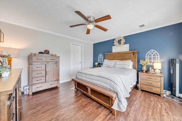 1028 Park Mountain Ter, Huddleston, VA 24104 - bedroom with wood finished floors, baseboards, crown molding, ceiling fan, and a textured ceiling