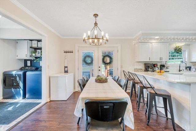 1028 Park Mountain Ter, Huddleston, VA 24104 - dining area with independent washer and dryer, dark wood finished floors, a chandelier, french doors, and ornamental molding