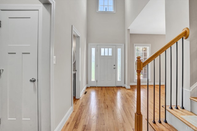 238 Ridgeline Dr, Concord, VA 24538 - foyer with healthy amount of natural light, light wood finished floors, a towering ceiling, stairs, and baseboards