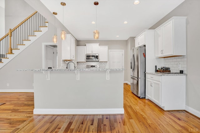238 Ridgeline Dr, Concord, VA 24538 - kitchen with stainless steel appliances, a peninsula, a kitchen breakfast bar, backsplash, and recessed lighting