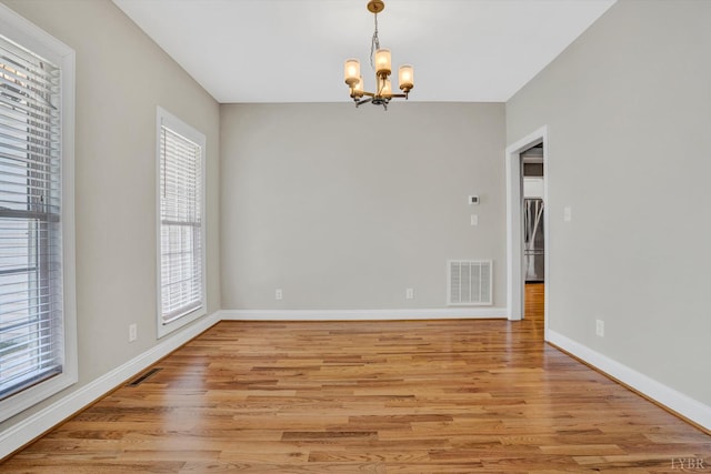 238 Ridgeline Dr, Concord, VA 24538 - spare room featuring a chandelier, light wood finished floors, and baseboards