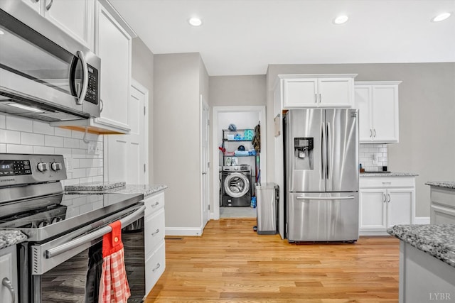 238 Ridgeline Dr, Concord, VA 24538 - kitchen featuring stainless steel appliances, washer / clothes dryer, backsplash, white cabinetry, and recessed lighting