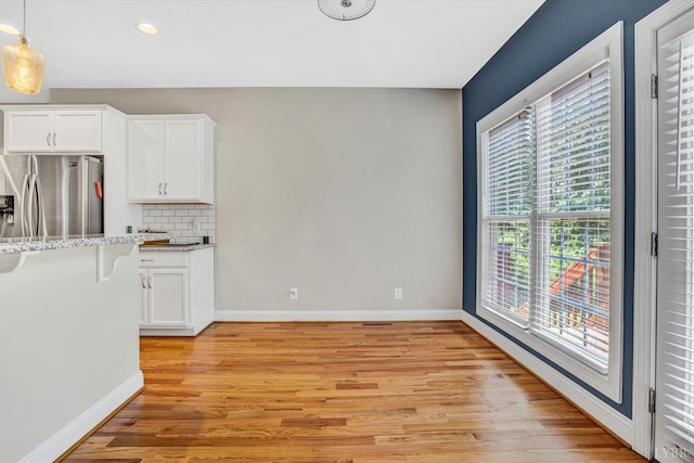 238 Ridgeline Dr, Concord, VA 24538 - kitchen with stainless steel fridge, light wood-style floors, white cabinetry, baseboards, and recessed lighting