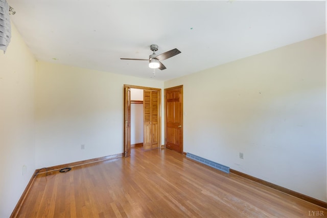1129 Croft Ln, Bedford, VA 24523 - unfurnished bedroom featuring baseboards, light wood-style floors, a closet, and ceiling fan