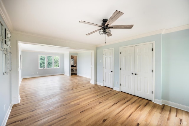7845 Bear Creek Rd, Gladys, VA 24554 - unfurnished bedroom featuring crown molding, light wood-style floors, multiple closets, and ceiling fan