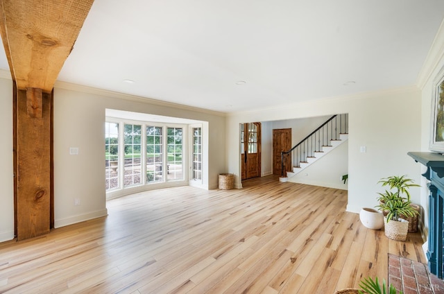 7845 Bear Creek Rd, Gladys, VA 24554 - unfurnished living room featuring ornamental molding, light wood finished floors, and stairway