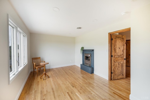 7845 Bear Creek Rd, Gladys, VA 24554 - living area featuring light wood finished floors and a brick fireplace