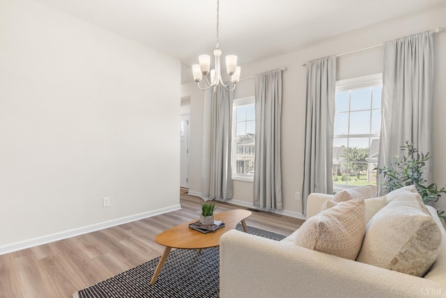 189 Traverse Dr, Evington, VA 24550 - living area featuring a chandelier, healthy amount of natural light, and light wood-style flooring