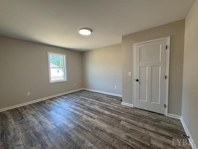2304 Spring Grove Rd, Spout Spring, VA 24593 - empty room with dark wood finished floors and baseboards