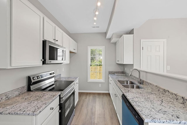 419 Wadsworth St, Lynchburg, VA 24501 - kitchen featuring stainless steel appliances, light wood-style flooring, white cabinets, and light stone counters