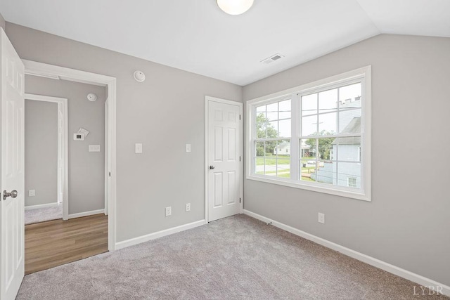 419 Wadsworth St, Lynchburg, VA 24501 - unfurnished bedroom featuring carpet floors and vaulted ceiling
