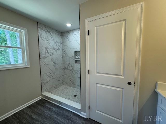 2350 Spring Grove Rd, Spout Spring, VA 24593 - bathroom featuring tiled shower, wood finished floors, vanity, baseboards, and recessed lighting