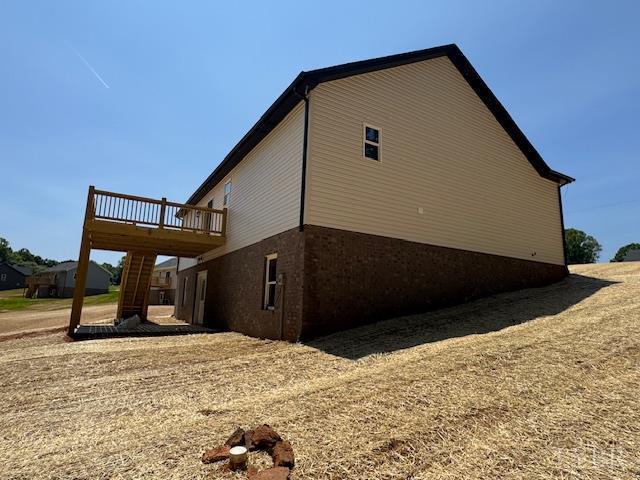 2350 Spring Grove Rd, Spout Spring, VA 24593 - view of side of property featuring a deck and brick siding