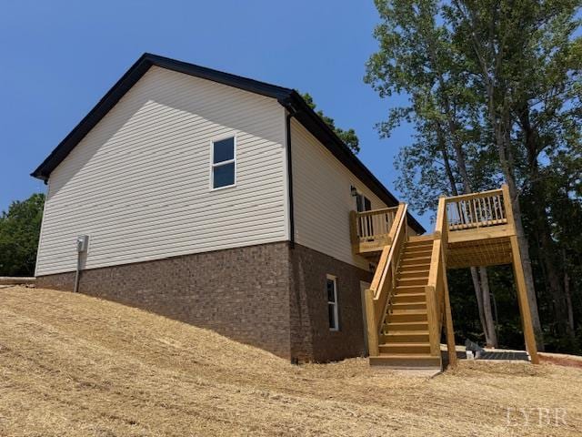 2350 Spring Grove Rd, Spout Spring, VA 24593 - view of side of home featuring stairs and a deck