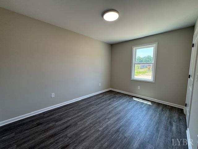 2350 Spring Grove Rd, Spout Spring, VA 24593 - empty room with dark wood finished floors and baseboards