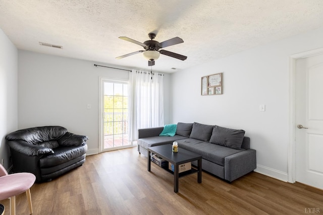 100 Capstone Dr Unit 207, Lynchburg, VA 24502 - living area with wood finished floors, ceiling fan, and a textured ceiling