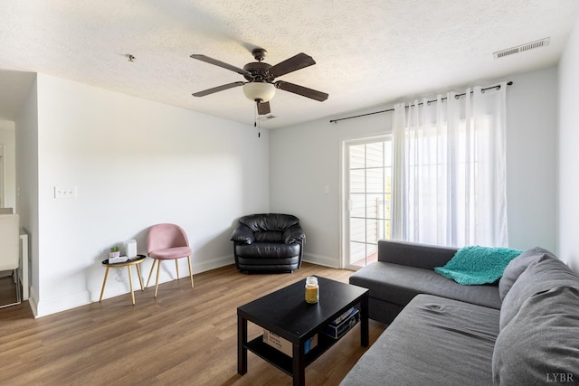 100 Capstone Dr Unit 207, Lynchburg, VA 24502 - living room featuring a textured ceiling, wood finished floors, and a ceiling fan