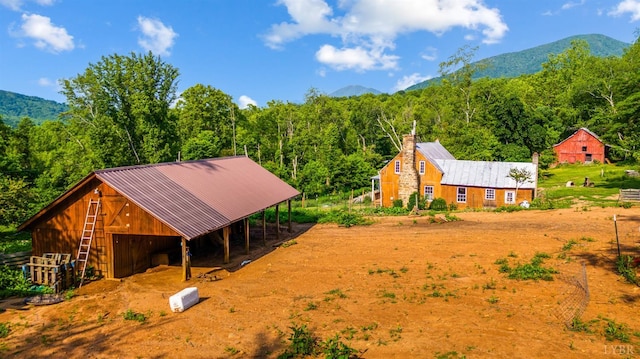 1807 Wheats Valley Rd, Bedford, VA 24532 - exterior space featuring a view of trees, a mountain view, metal roof, and a chimney