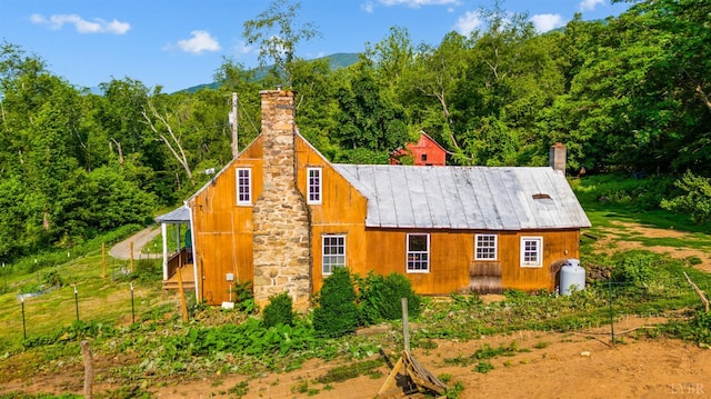 1807 Wheats Valley Rd, Bedford, VA 24532 - view of front of house with a chimney and a view of trees