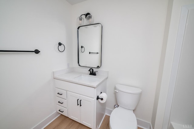556 Leesville Rd Unit 907, Lynchburg, VA 24502 - bathroom featuring toilet, vanity, baseboards, and wood finished floors