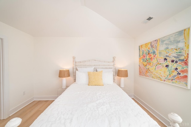 556 Leesville Rd Unit 907, Lynchburg, VA 24502 - bedroom with light wood-type flooring, lofted ceiling, and baseboards