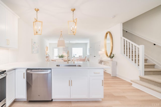 556 Leesville Rd Unit 907, Lynchburg, VA 24502 - kitchen featuring stainless steel dishwasher, a sink, a chandelier, a peninsula, and open floor plan