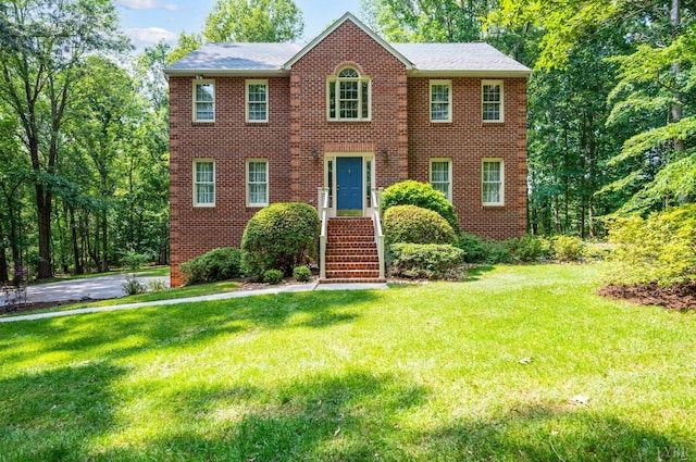 106 Stirling Ct, Forest, VA 24551 - colonial home featuring a front yard and brick siding