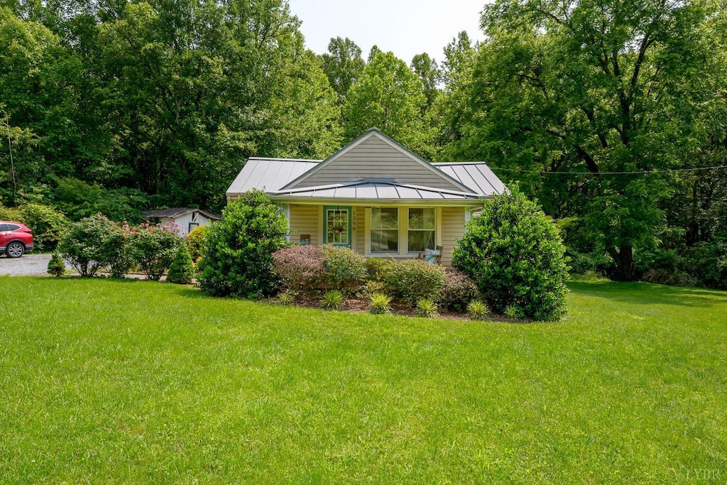 1398 English Tavern Rd, Lynchburg, VA 24501 - view of front facade featuring a standing seam roof, a front lawn, and metal roof