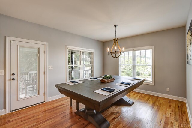 1013 Cobblestone Ln, Forest, VA 24551 - dining space featuring baseboards, light wood-style flooring, a chandelier, and a desk