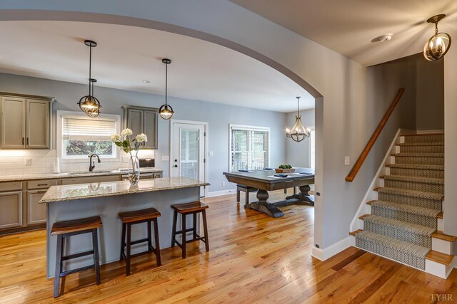 1013 Cobblestone Ln, Forest, VA 24551 - kitchen with a sink, a kitchen breakfast bar, a kitchen island, and healthy amount of natural light