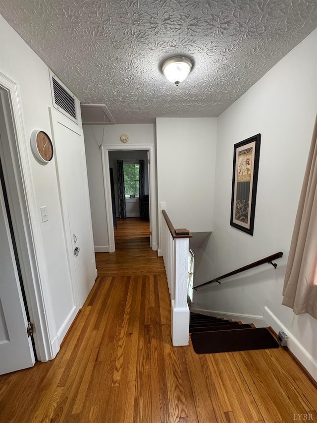 100 New Chapel Rd, Rustburg, VA 24588 - hall with an upstairs landing, attic access, wood finished floors, and baseboards