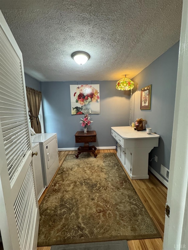 100 New Chapel Rd, Rustburg, VA 24588 - hall featuring light wood-type flooring, a textured ceiling, and baseboards