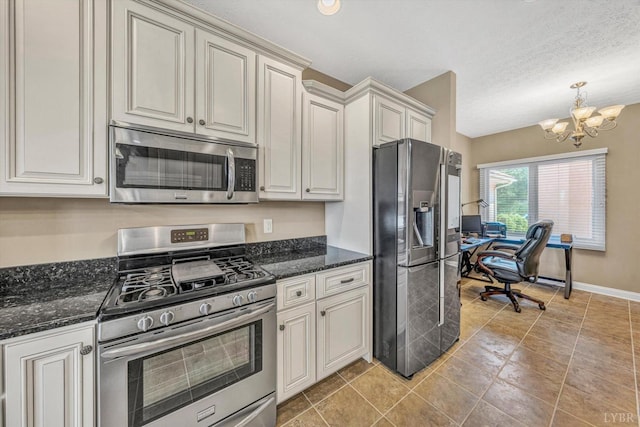 1066 Siesta Key Ct, Moneta, VA 24121 - kitchen with stainless steel appliances, a chandelier, an office area, baseboards, and dark stone countertops