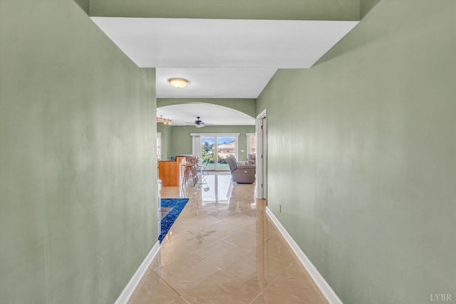 1066 Siesta Key Ct, Moneta, VA 24121 - corridor with baseboards, light marble finish flooring, and arched walkways