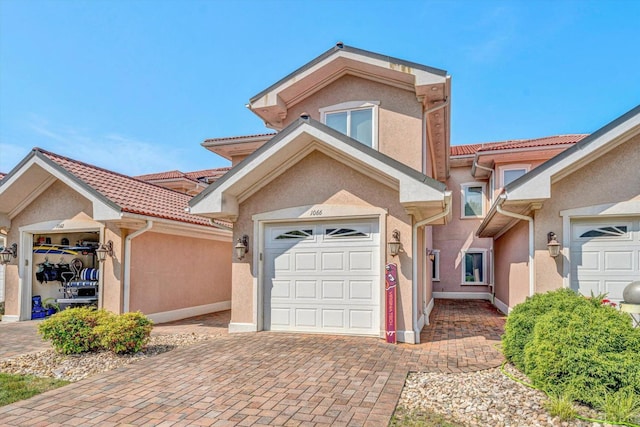 1066 Siesta Key Ct, Moneta, VA 24121 - view of property featuring decorative driveway, stucco siding, and a garage