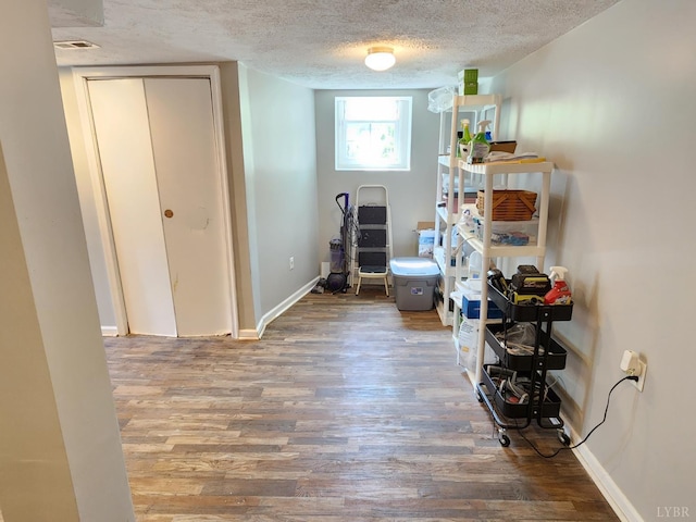 610 Dumas St, Lynchburg, VA 24502 - interior space featuring a textured ceiling, wood finished floors, and baseboards