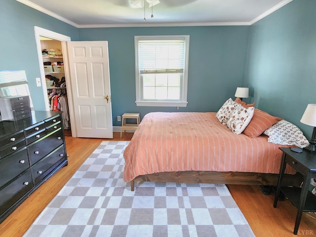 610 Dumas St, Lynchburg, VA 24502 - bedroom featuring a spacious closet, light wood-style flooring, crown molding, and a closet