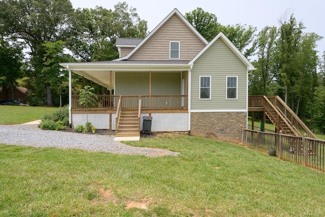 1032 Wiggington Rd, Lynchburg, VA 24502 - view of front of house featuring stairs, stone siding, a front lawn, and a wooden deck