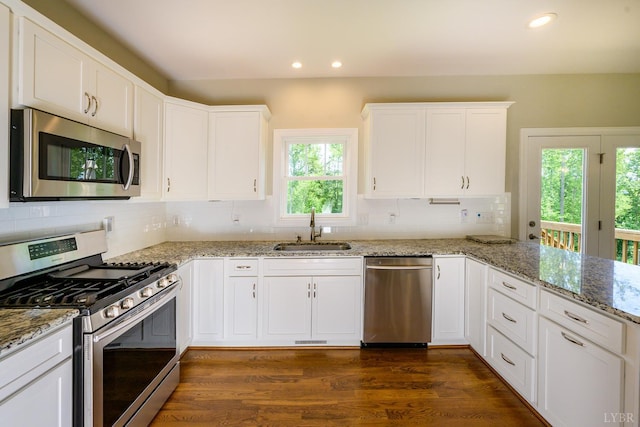 1032 Wiggington Rd, Lynchburg, VA 24502 - kitchen featuring stainless steel appliances, recessed lighting, white cabinetry, backsplash, and dark wood-style floors