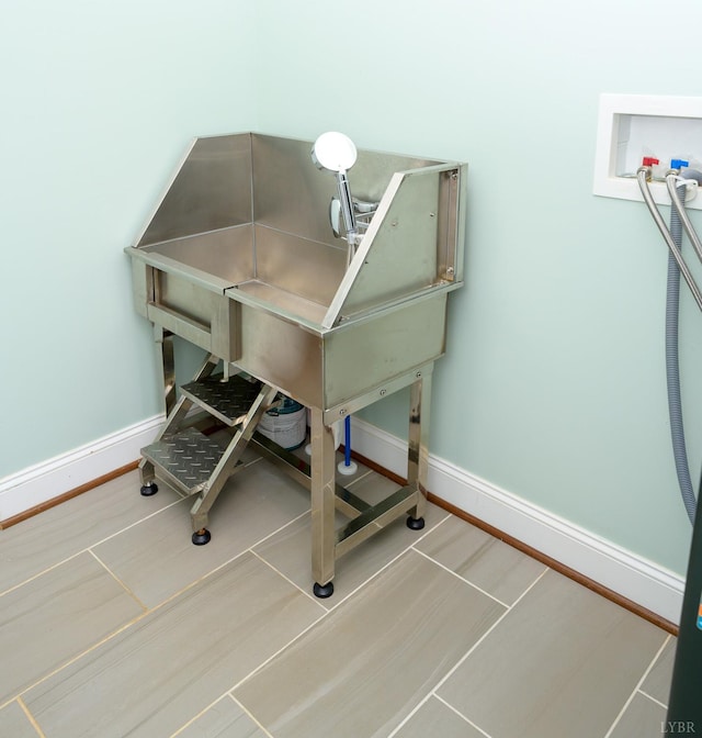 1032 Wiggington Rd, Lynchburg, VA 24502 - miscellaneous room featuring pet washing station and baseboards