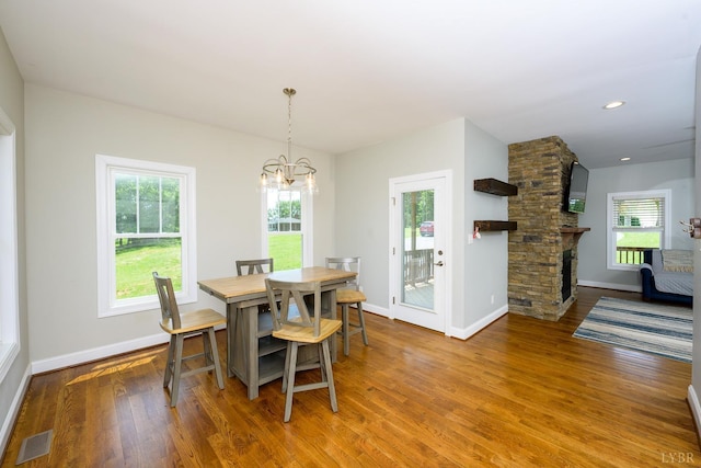 1032 Wiggington Rd, Lynchburg, VA 24502 - dining area featuring a chandelier, wood finished floors, plenty of natural light, recessed lighting, and a fireplace