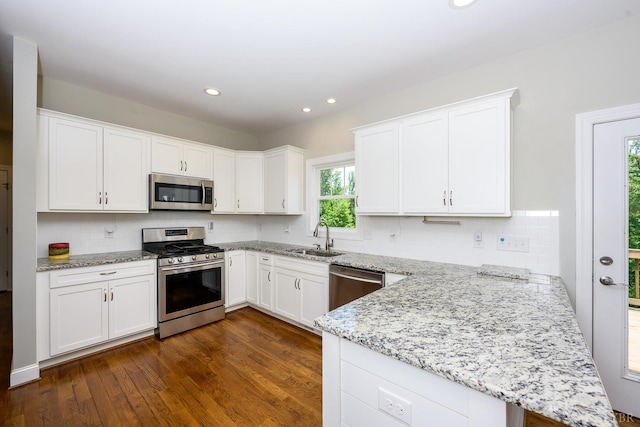 1032 Wiggington Rd, Lynchburg, VA 24502 - kitchen featuring appliances with stainless steel finishes, a peninsula, white cabinetry, and recessed lighting