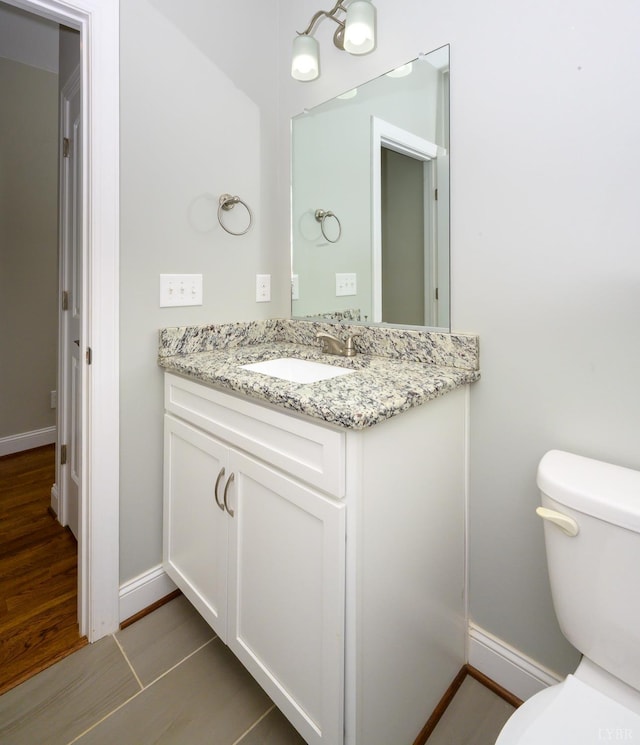 1032 Wiggington Rd, Lynchburg, VA 24502 - half bathroom with vanity and wood finished floors