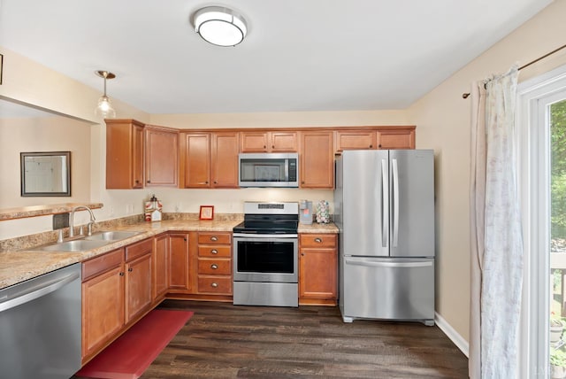 1810 Broadway St Unit 100, Lynchburg, VA 24501 - kitchen featuring appliances with stainless steel finishes, a sink, dark wood-style flooring, and light countertops